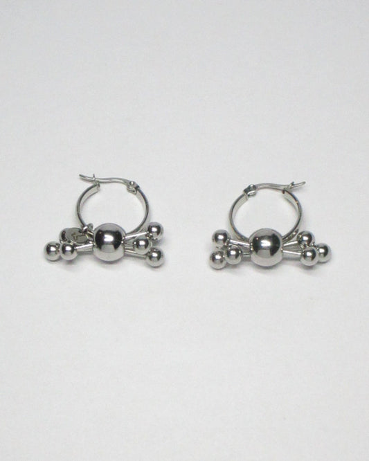 Multiple steel barbells decoration hoop earrings still portrait