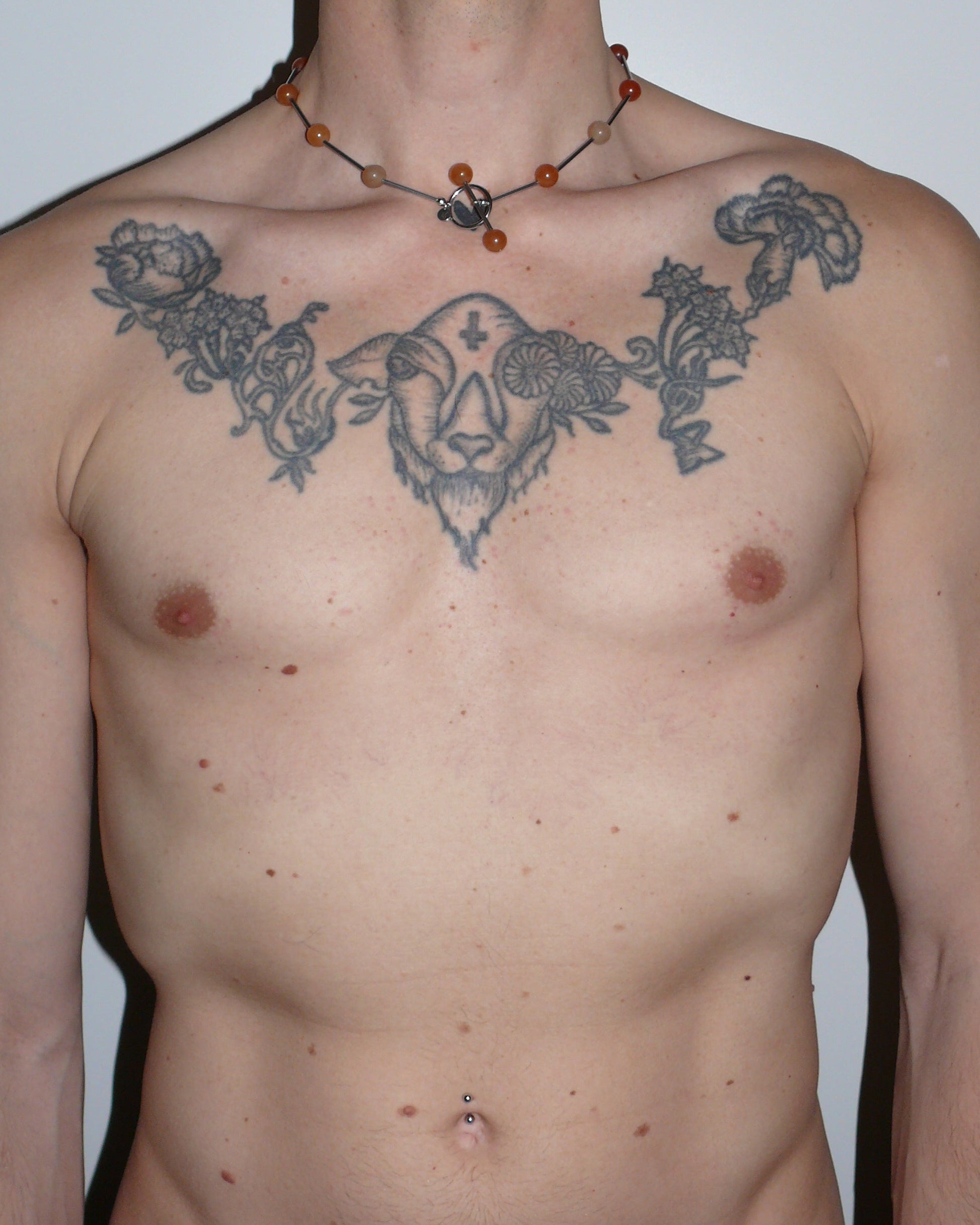 Red beaded necklace representing fire signs portrait on model