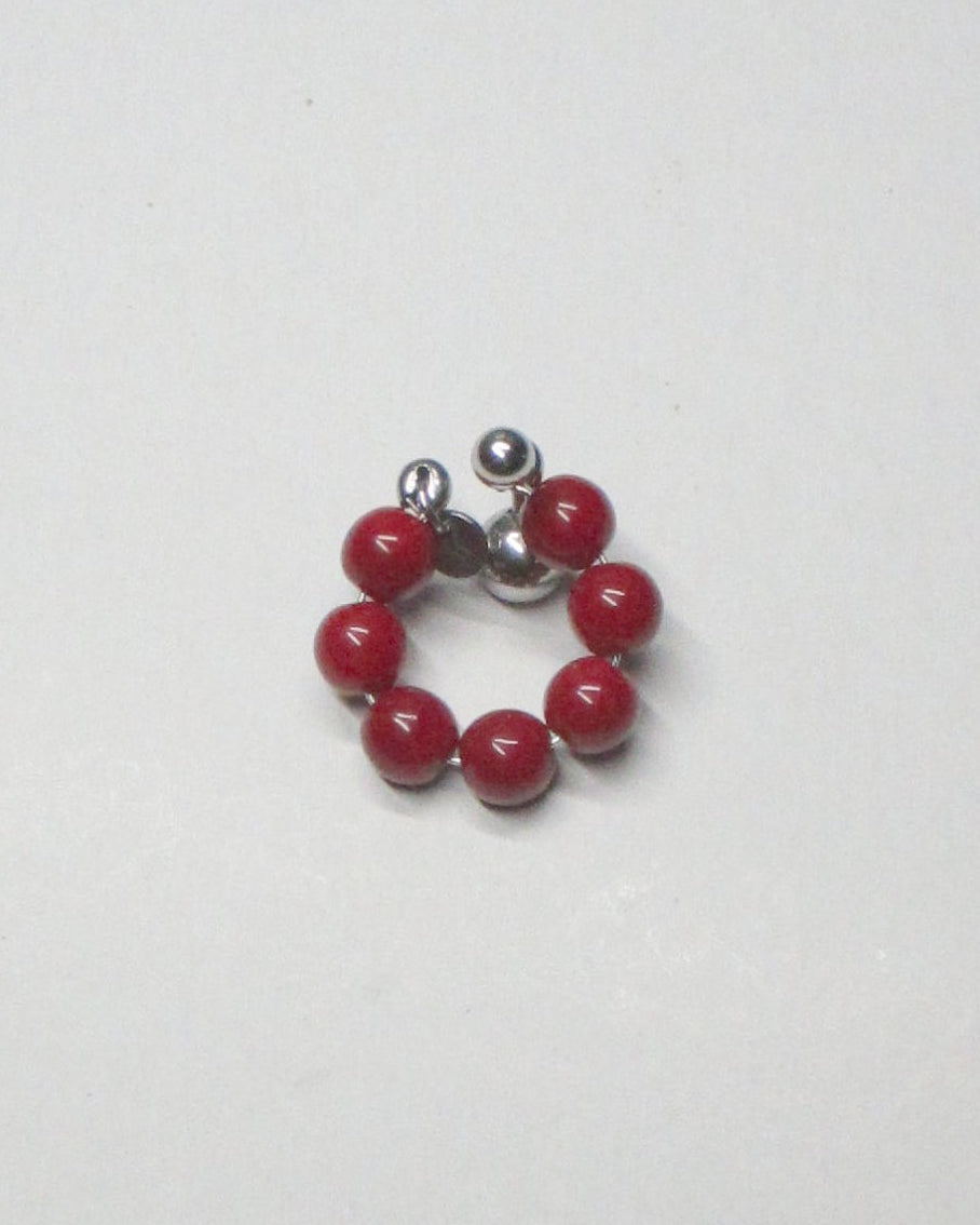 Red coral beads cuff with piercing decoration still portrait