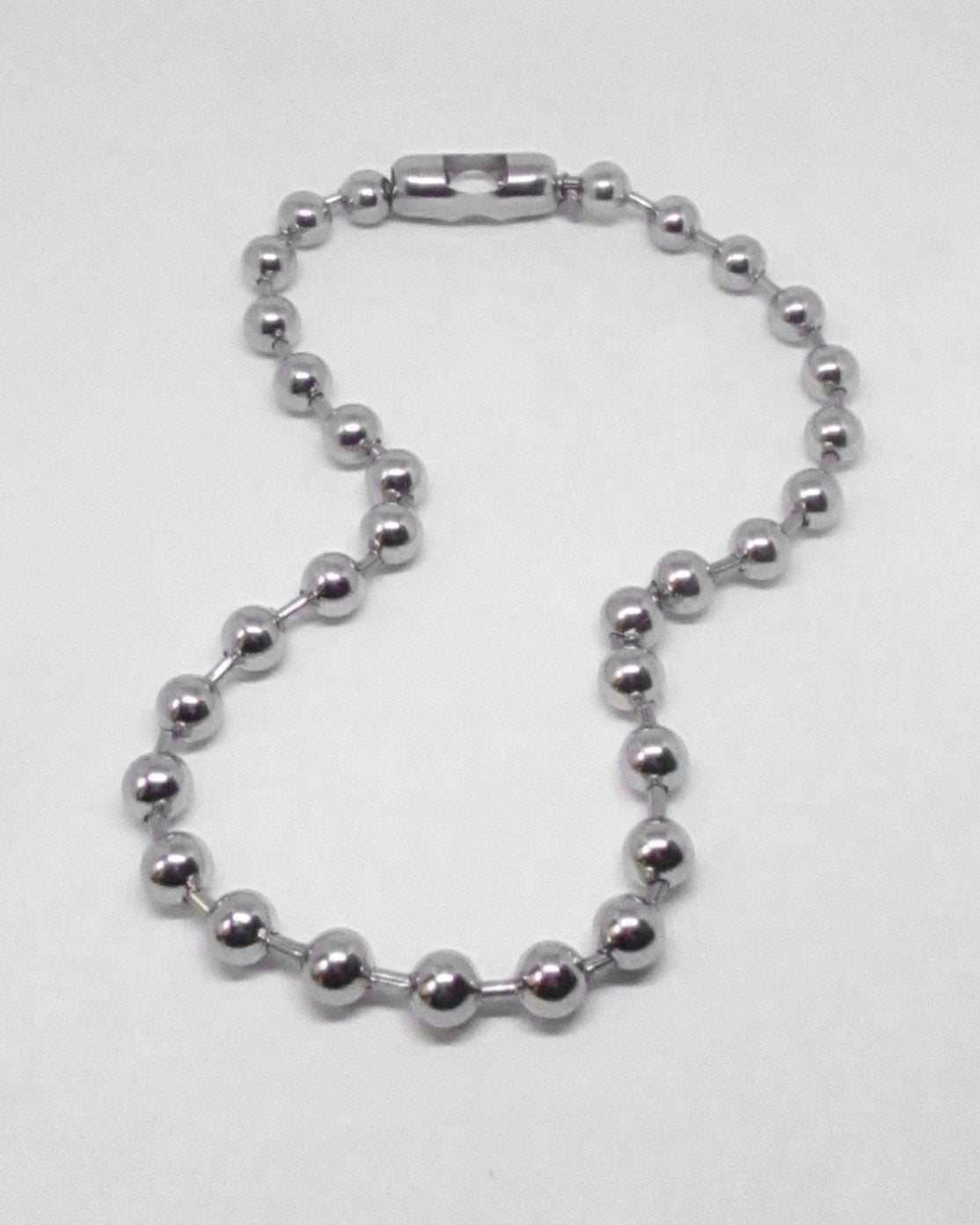 Silver beaded ball-chain necklace on a white background