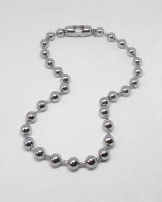 Silver beaded ball-chain necklace on a white background