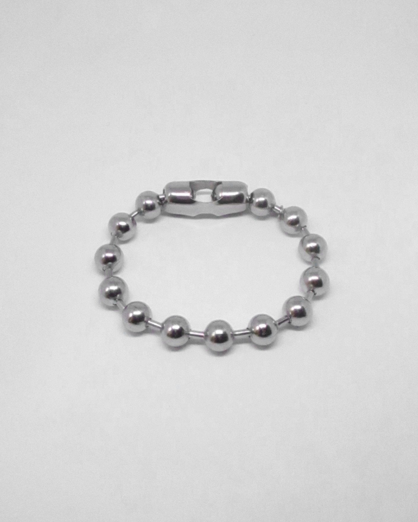 Silver beaded bracelet on a white background