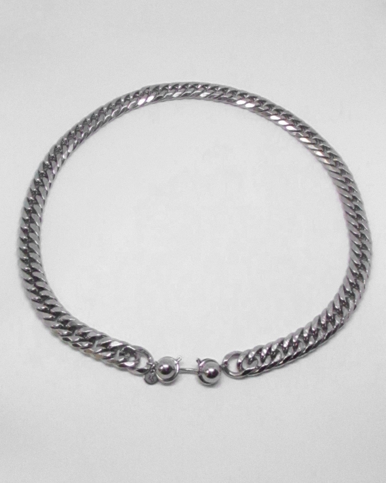 Silver chain necklace on a white background