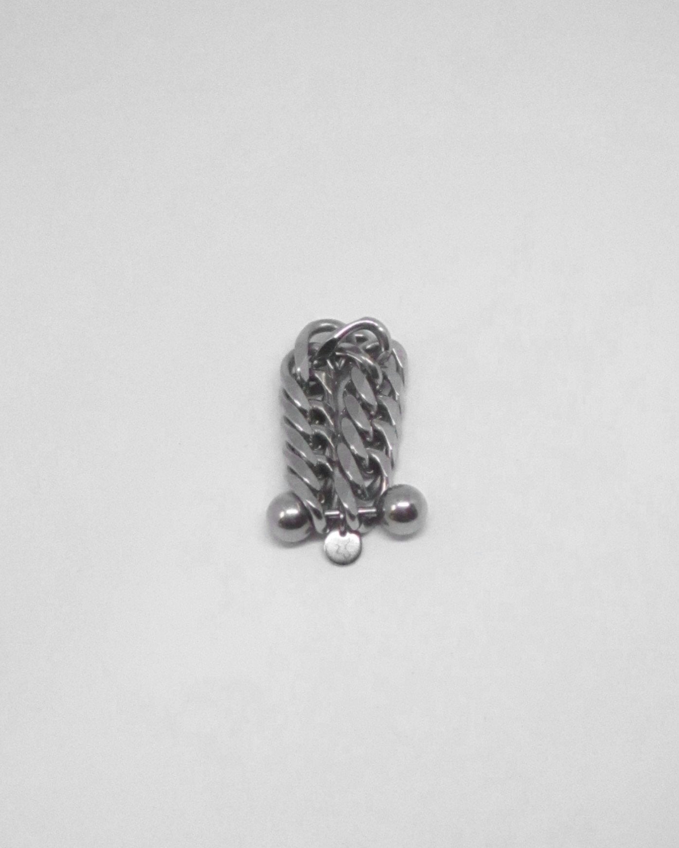 Silver chain with spherical ends on a white background