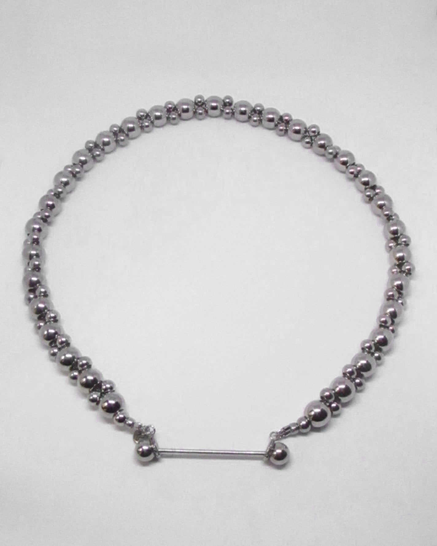 Silver double beaded necklace on a white background