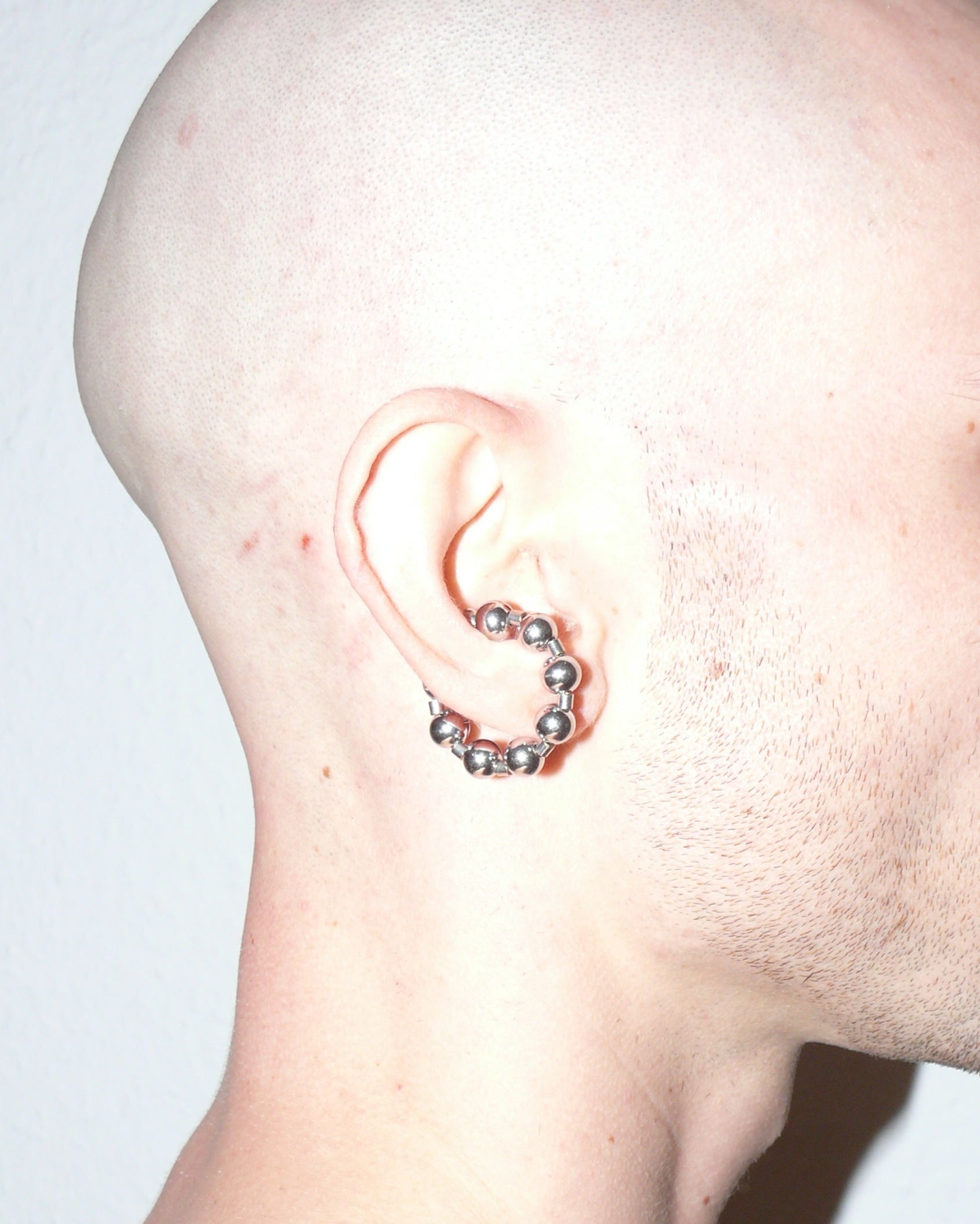 Steel ball chain cuff close up portrait lateral