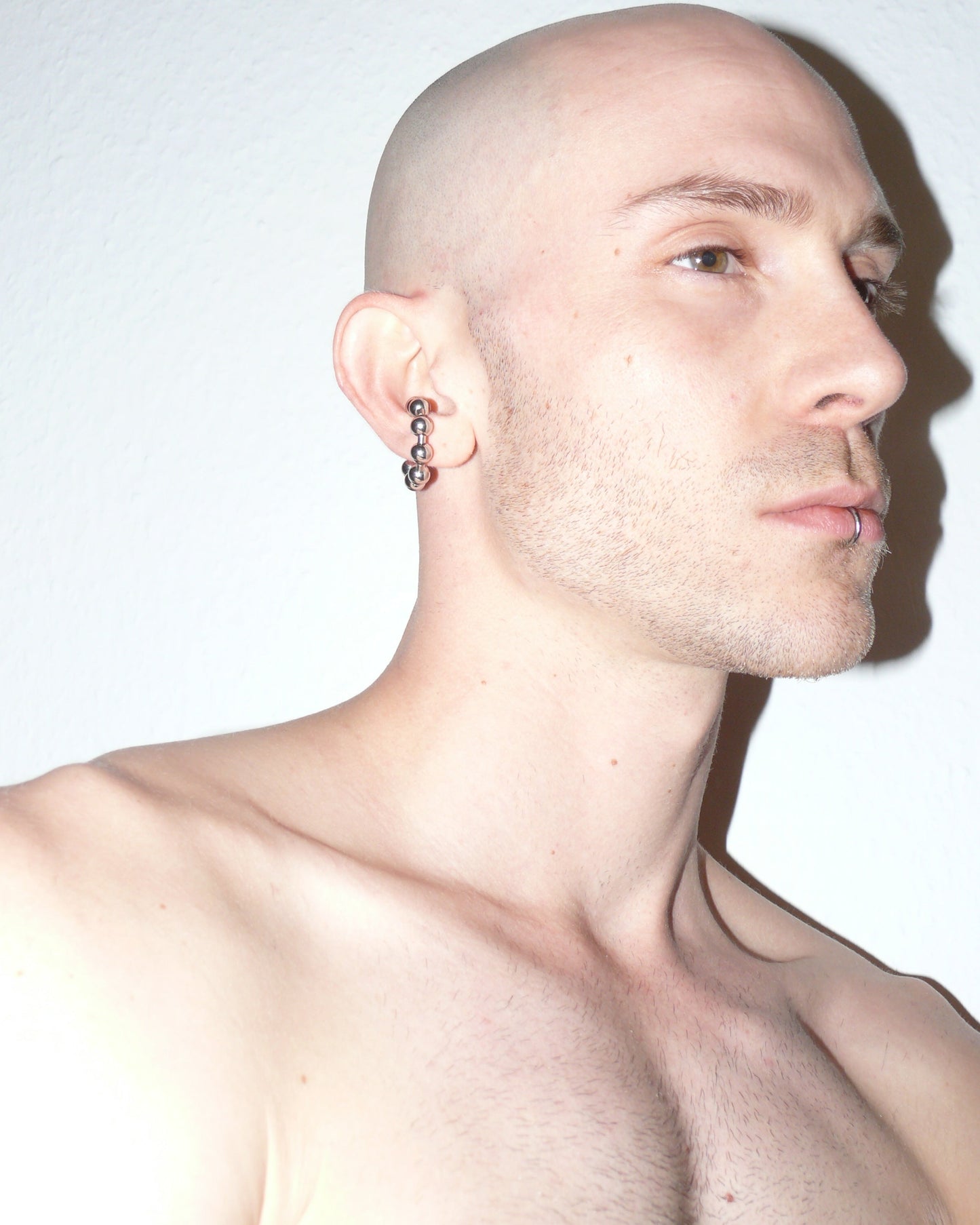 Steel ball chain cuff close up  portrait on model lateral down