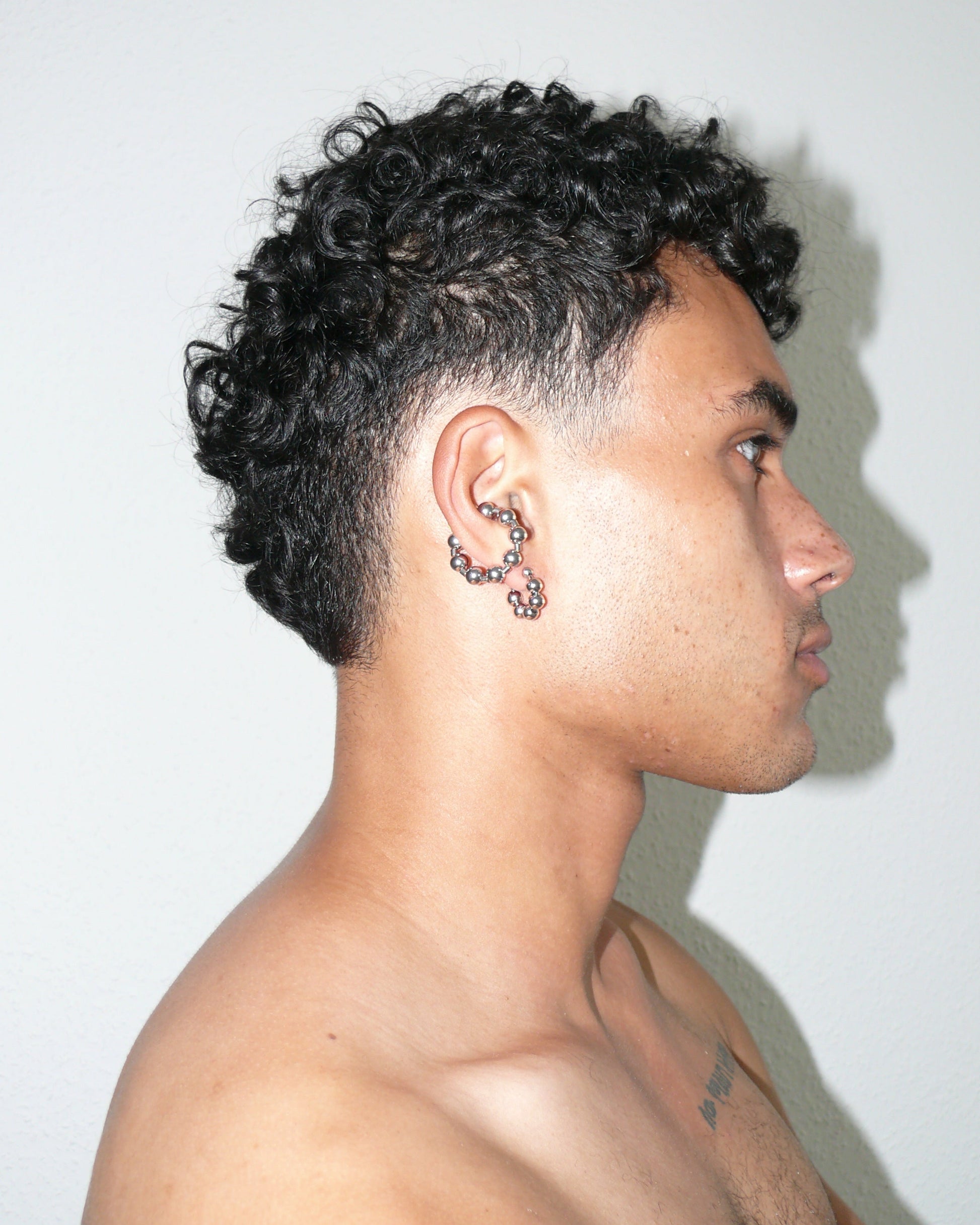 Steel ball chain cuff portrait on model lateral