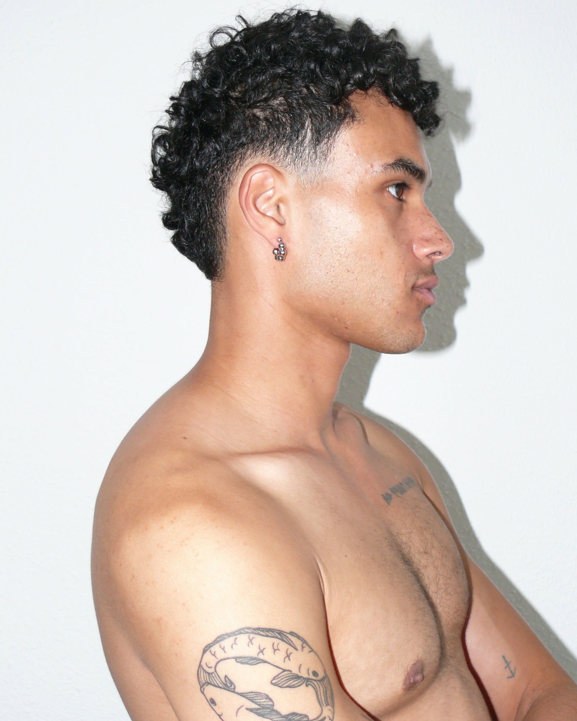 Steel ball chain mini open hoops earrings lateral portrait on black model