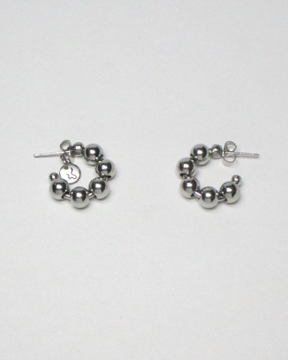 Steel ball chain mini open hoops earrings still portrait