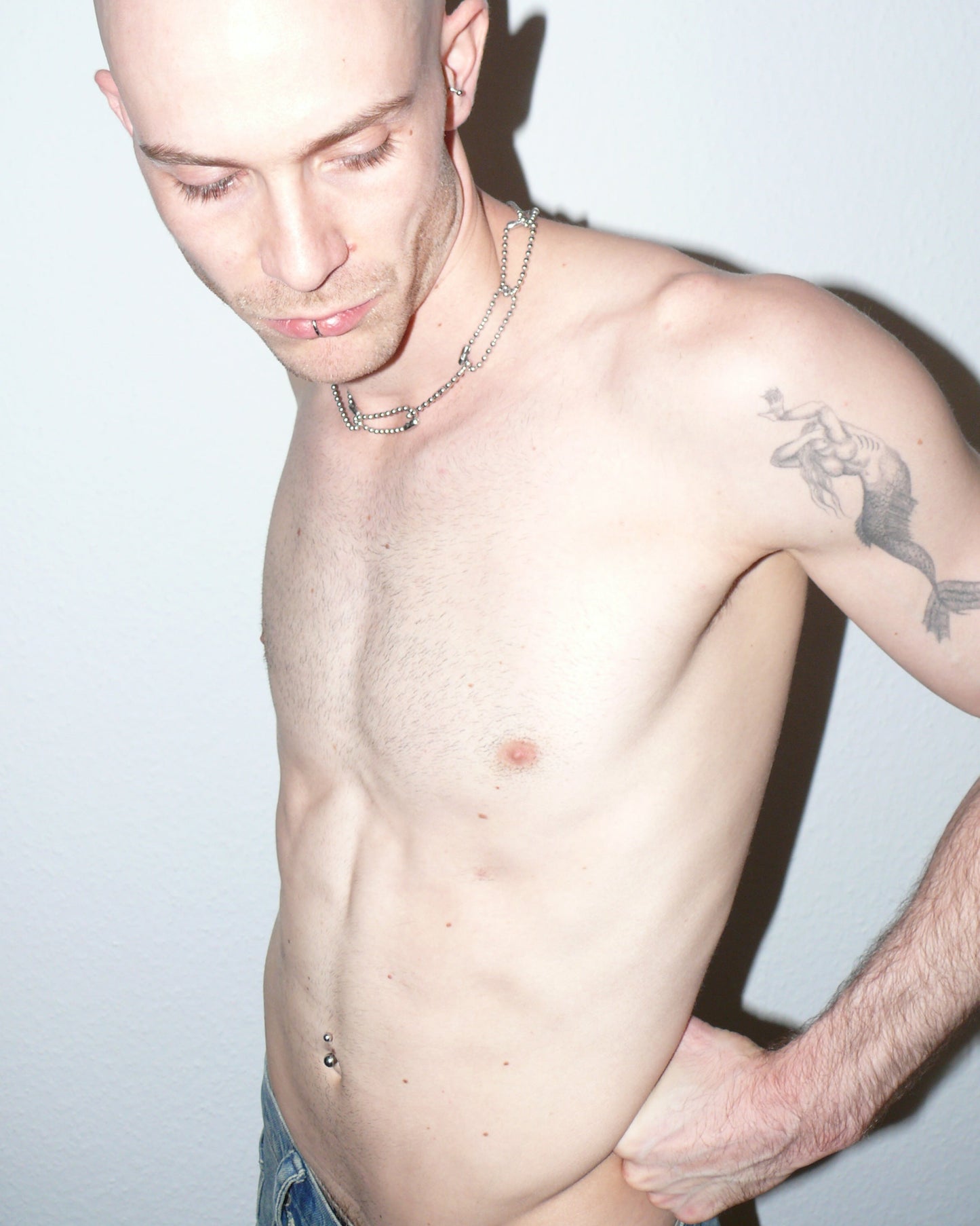 Steel ball chain multiple rings necklace portrait on model holding back