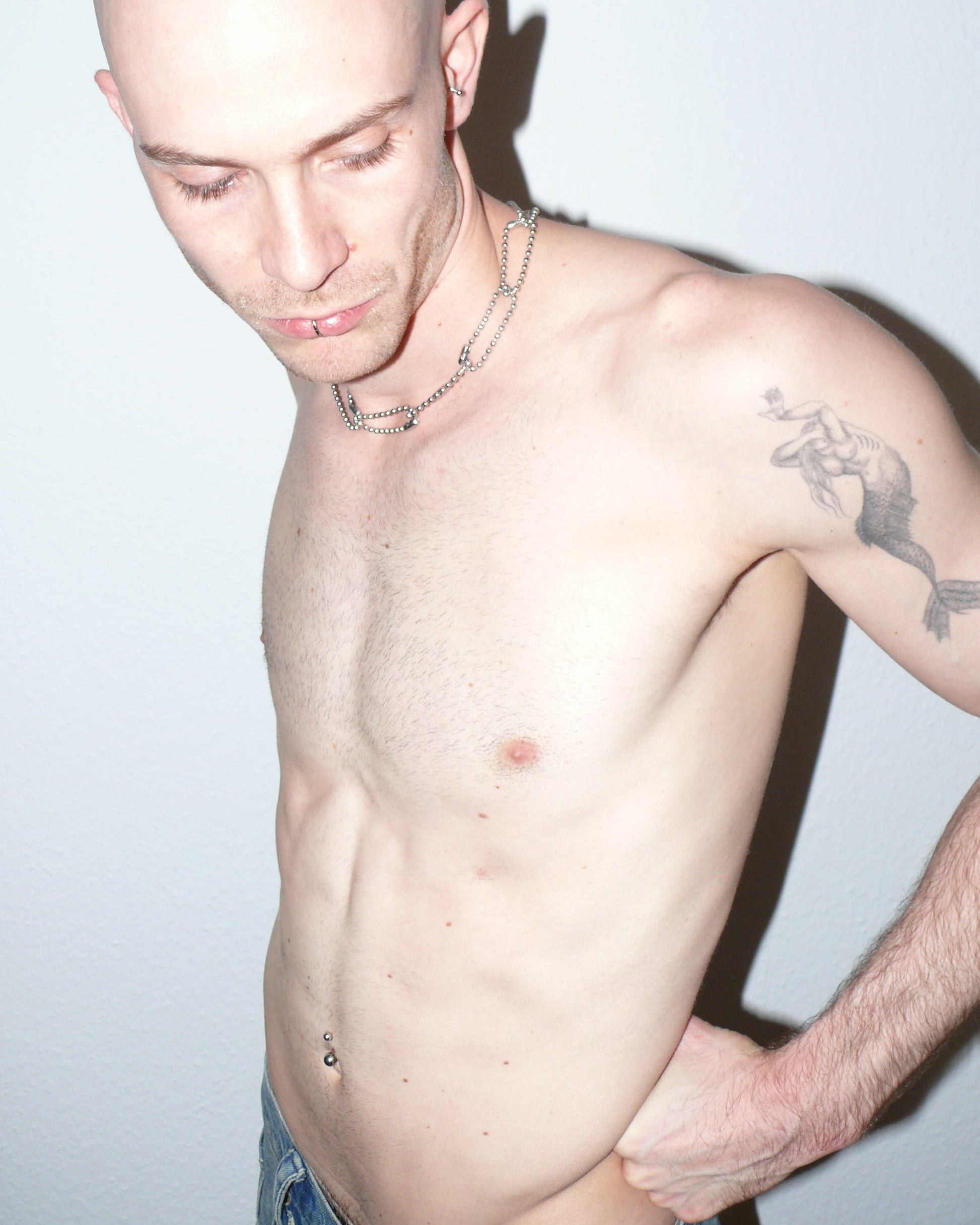 Steel ball chain multiple rings necklace portrait on model holding back