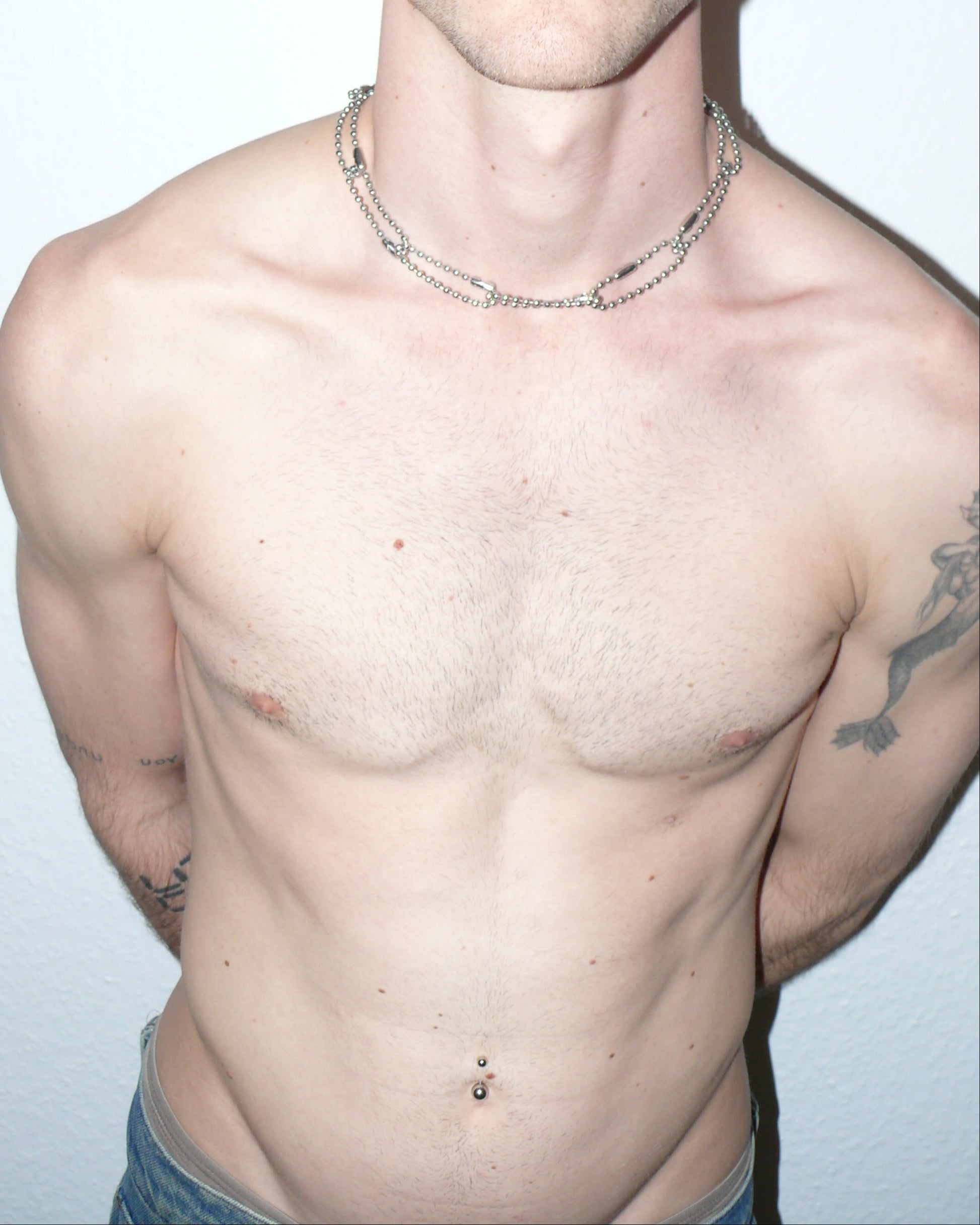 Steel ball chain multiple rings necklace portrait on model torso