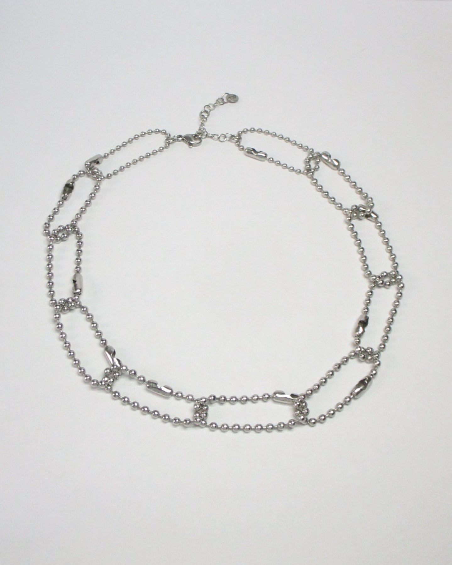 Steel ball chain multiple rings necklace still portrait