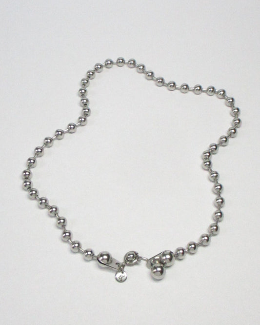 Steel ball chain necklace with piercing closure still fluid portrait