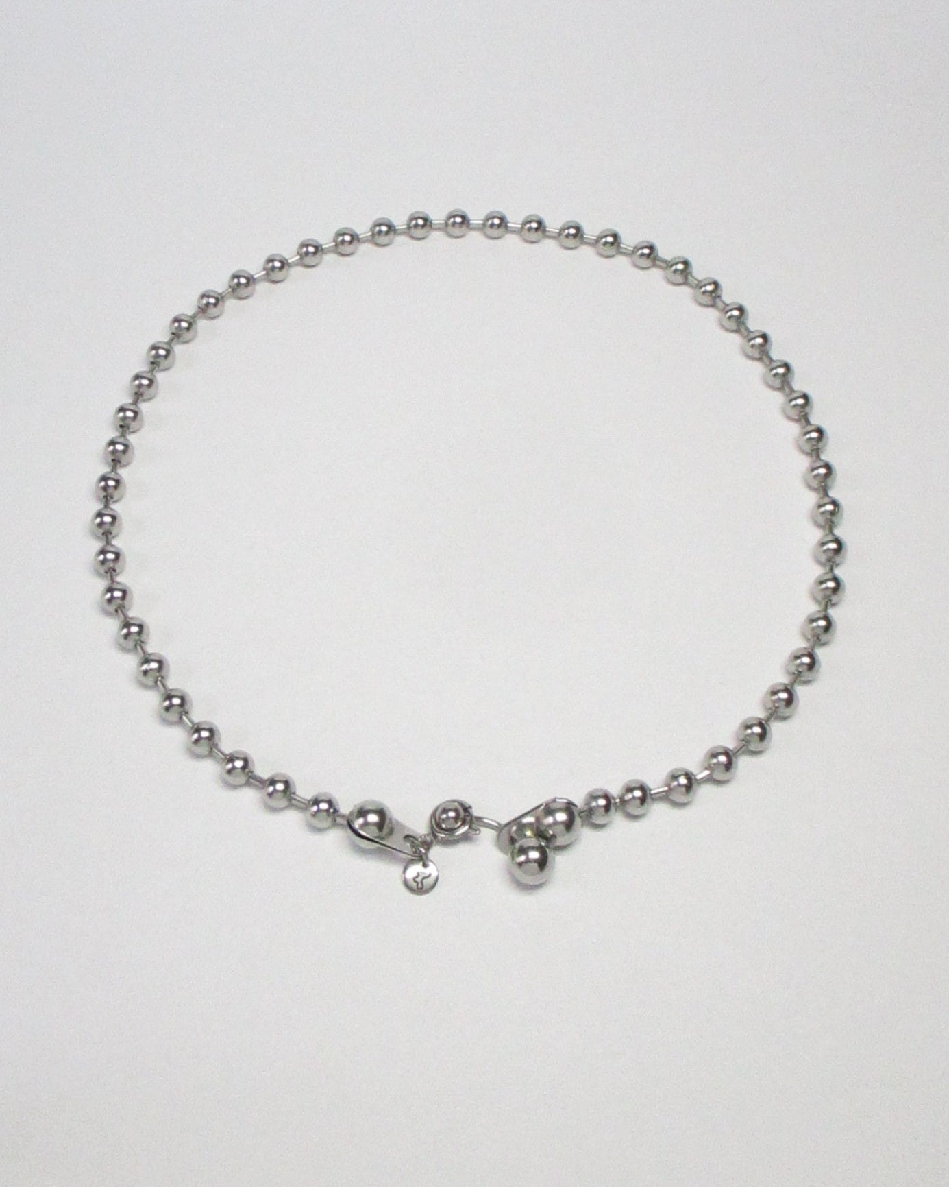 Steel ball chain necklace with piercing closure still portrait