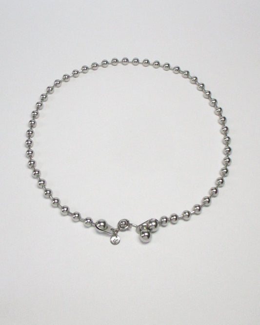 Steel ball chain necklace with piercing closure still portrait