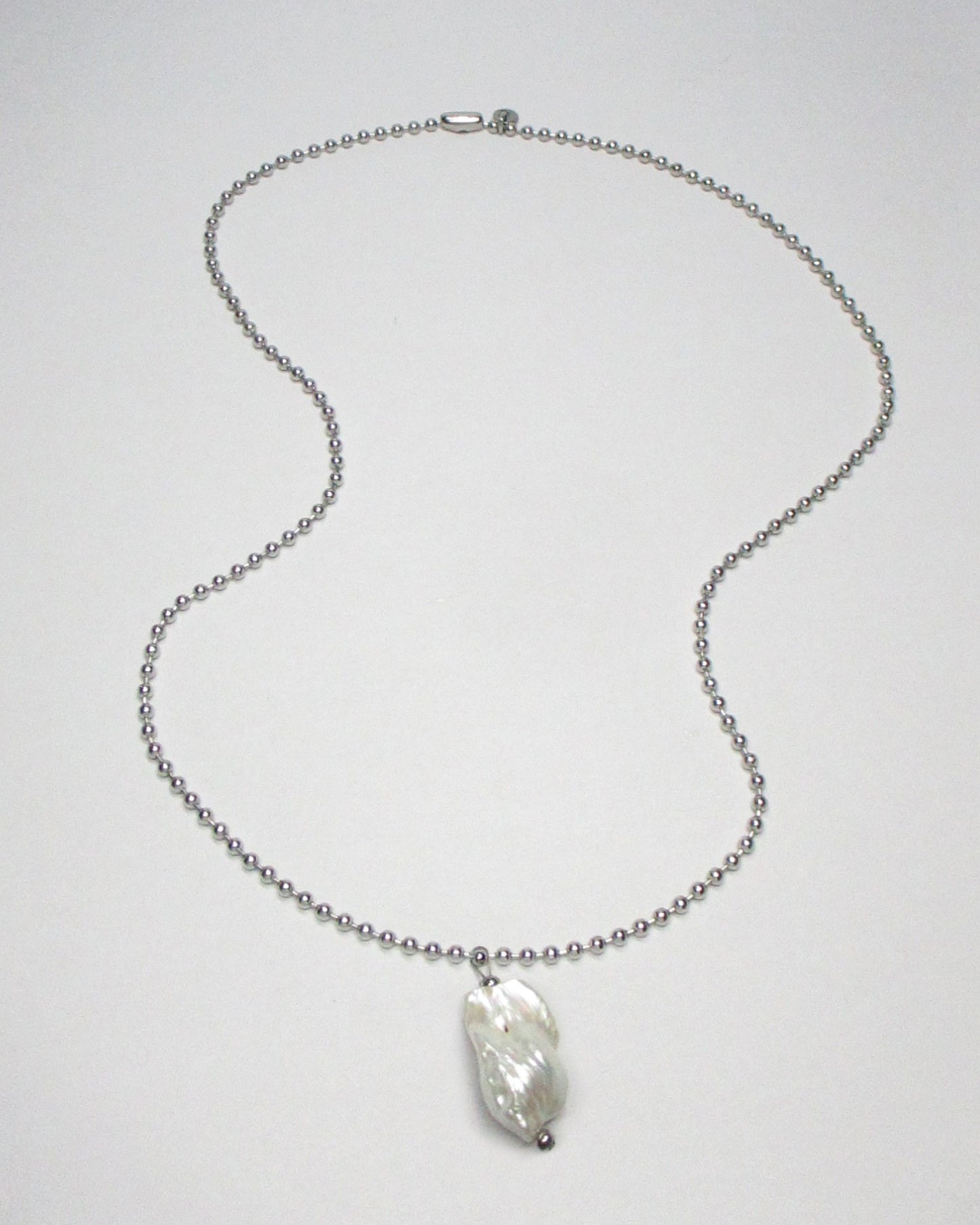 Steel ball chain with baroque freshwater pearl pendant still fluid portrait