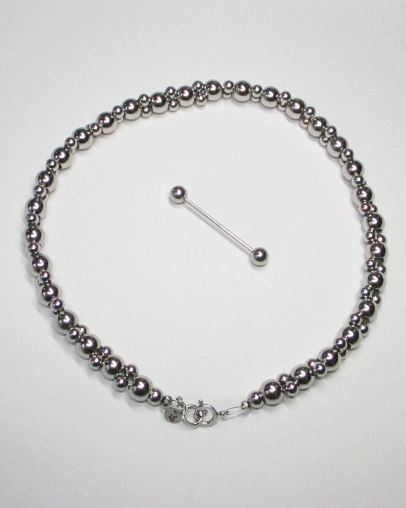 Steel beaded necklace piercing with closure detatched still portrait