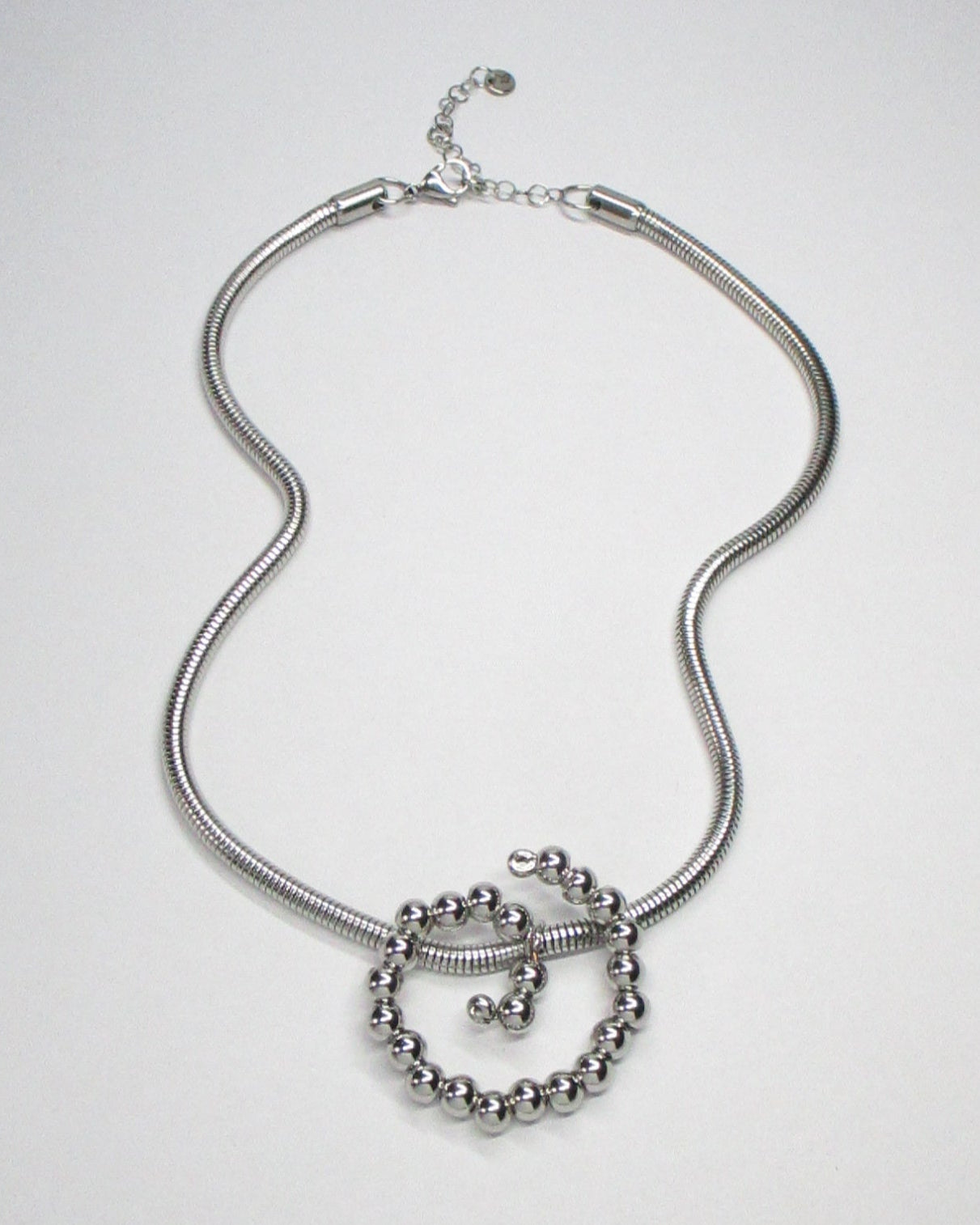 Steel beaded spiral snake chain necklace fluid still portrait