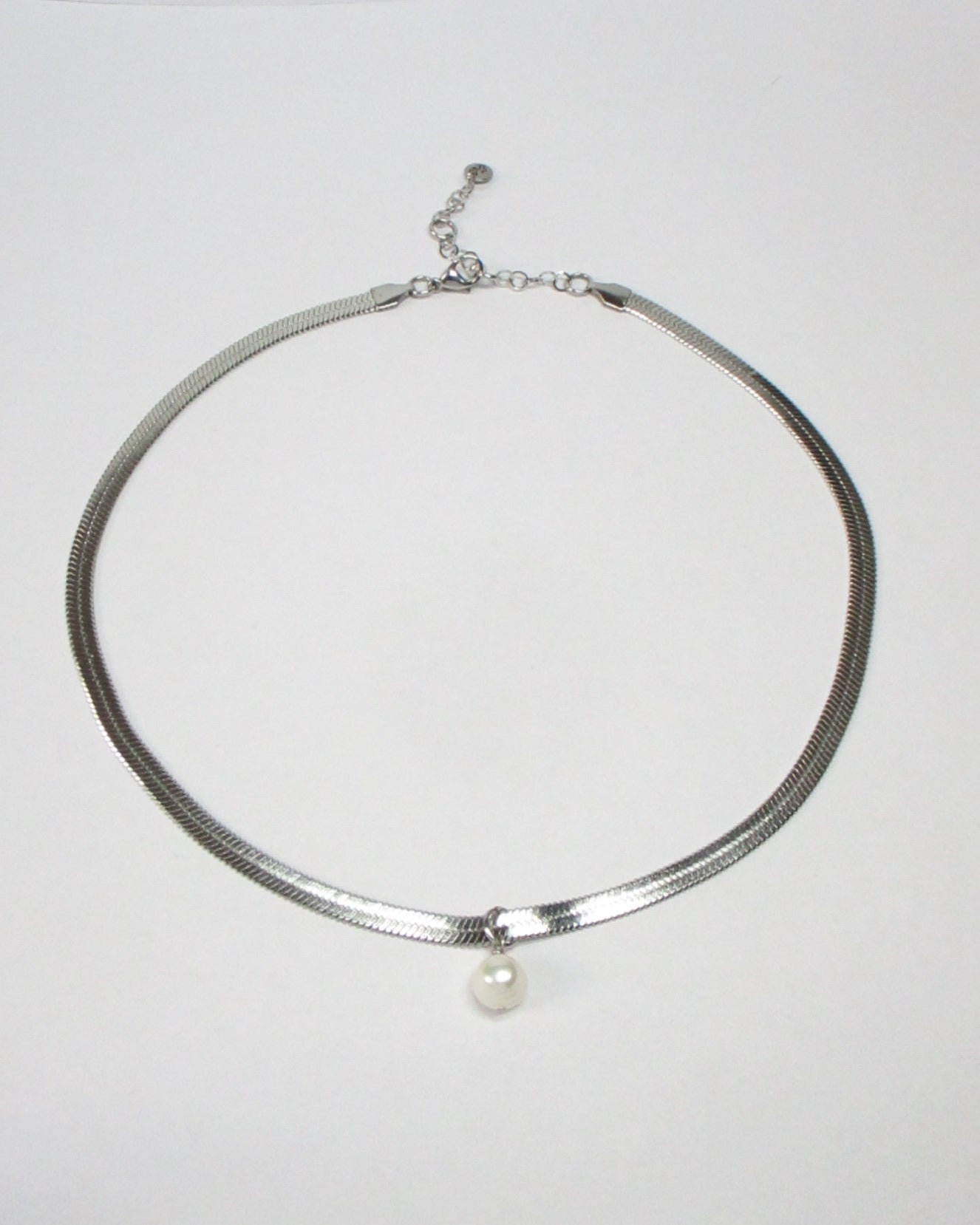 Steel flat snake chain with pearl pendant still portrait