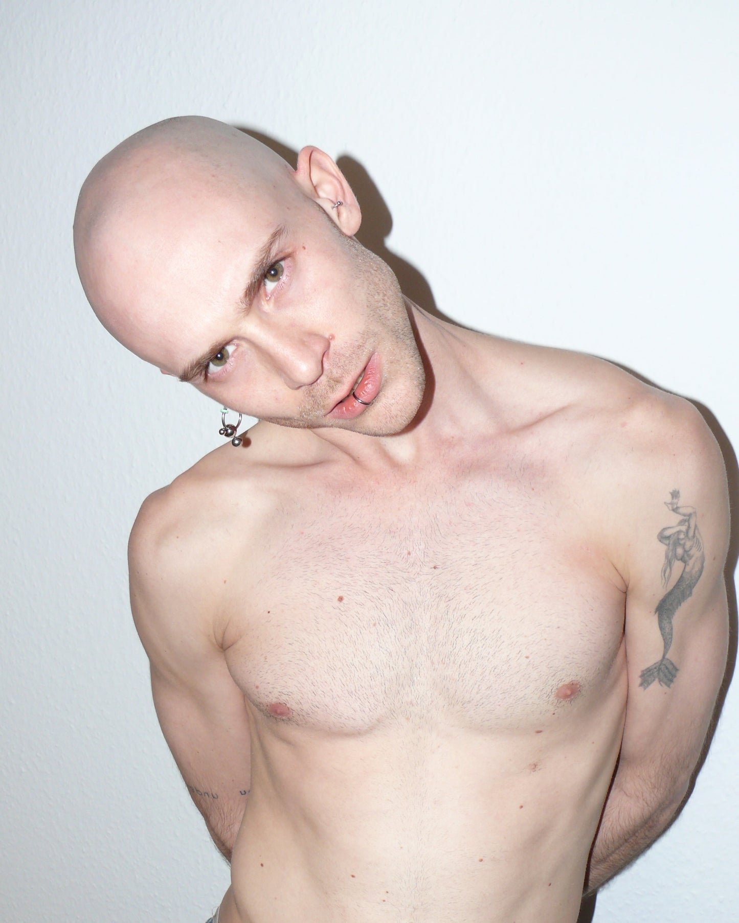 Steel hoops earrings with banana piercings decoration portrait on model