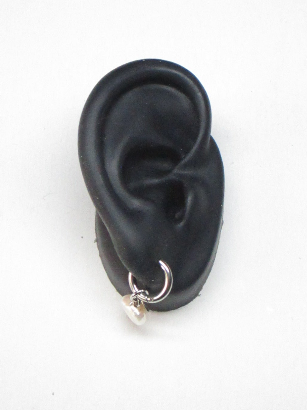 Steel micro hoop with pearl pendant portrait on ear model