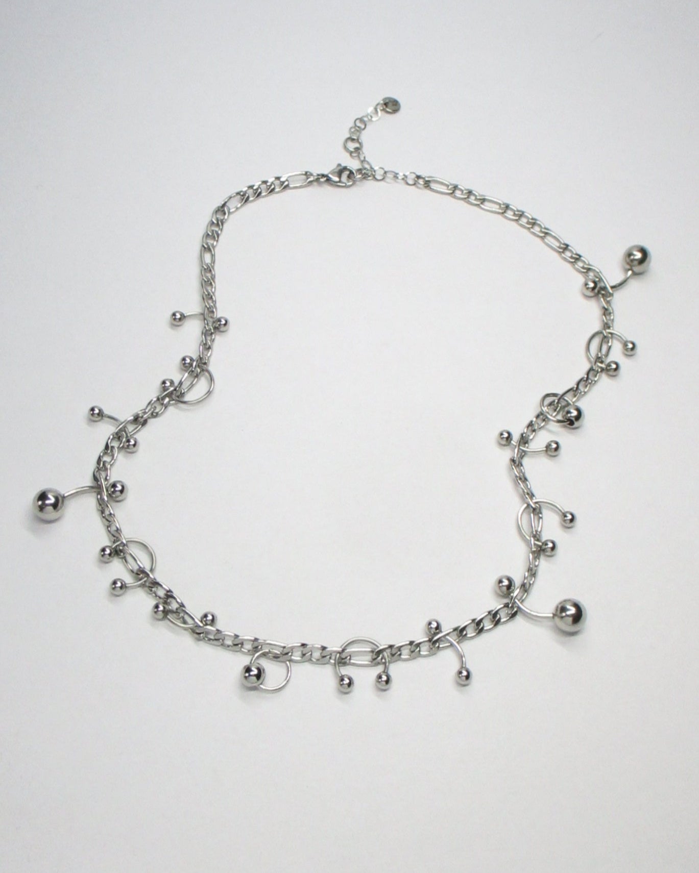 Steel mixed piercings necklace still fluid portrait