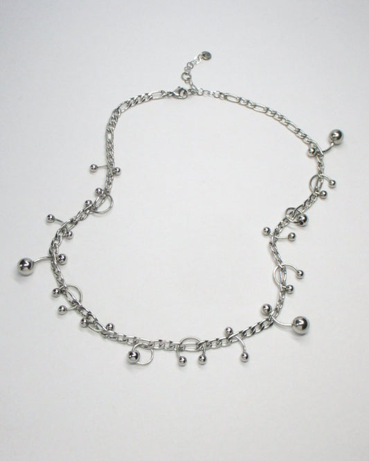 Steel mixed piercings necklace still fluid portrait