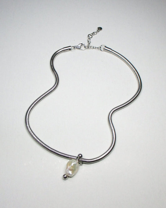 Steel snake chain with pearl pendant decorated with piercing still fluid portrait