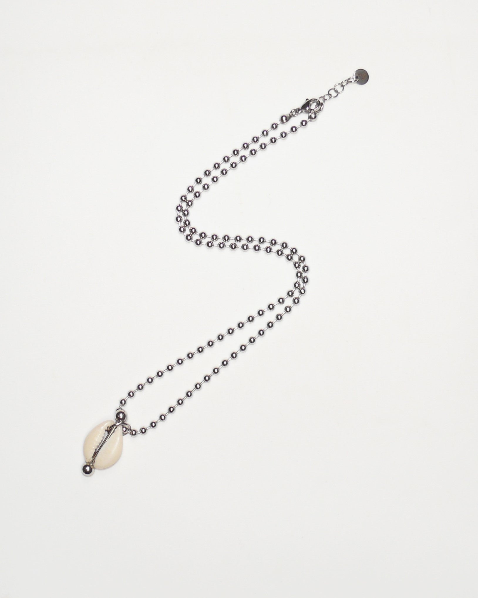core gem necklace cowrie piercing pearly still